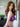 Person wearing a purple lace lingerie set with 'NORMAN' branding.