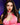 Person wearing a pink outfit with a blurred background