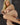 A highly realistic beige sex doll with long blonde hair