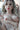 Sex doll with realistic features and open garment