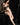 Life-size sex doll posing in black lingerie on dark background