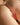 Partial view of a person's body with a focus on the buttocks.