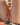 Close-up of a child's legs on a patterned blanket