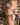 Person wearing a gray bikini against a patterned background