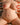Partial nude body on a patterned fabric background