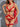 A woman wearing a red lingerie set with lace details and a G-string design.