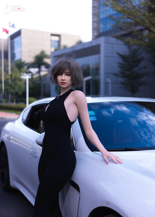 Woman in a black dress leaning against a white car with a cityscape background