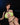 Woman wearing a green bikini against a dark background