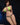 Model wearing a bright green bikini with black straps against a dark background