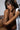 Nude sex doll holding a white towel.