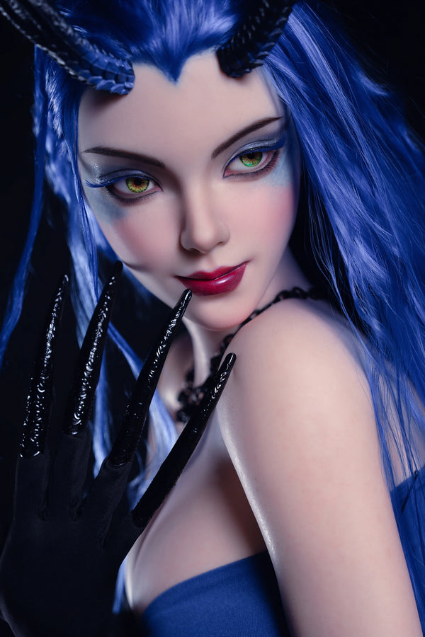 Person with blue hair and dark makeup wearing a black glove
