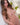 Sex doll with long brown hair in a decorative setting