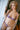 This image features a realistic adult doll designed to resemble a pregnant woman, presented in a vibrant, purple lingerie outfit. The doll is meticulously detailed, boasting a lifelike appearance with a soft, natural skin tone and a thoughtfully designed hair style that enhances its realistic look.
