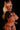 Animated character with animal ears and a black outfit on a black background