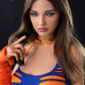 A real silicone sex doll named Daisy with long brown hair and beige skin, wearing a blue and orange outfit with a crop top and orange boobs.