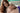 Partial topless woman with long brown hair in a room with a visible brand logo.