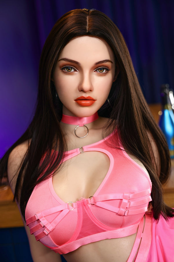 Person wearing a pink outfit with a blurred background