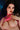Sex doll with dark hair and red lipstick against a blurred background