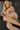 A highly realistic beige sex doll with long blonde hair