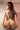 A nude doll showing back side