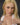 Video of person in white dress standing against a dark background